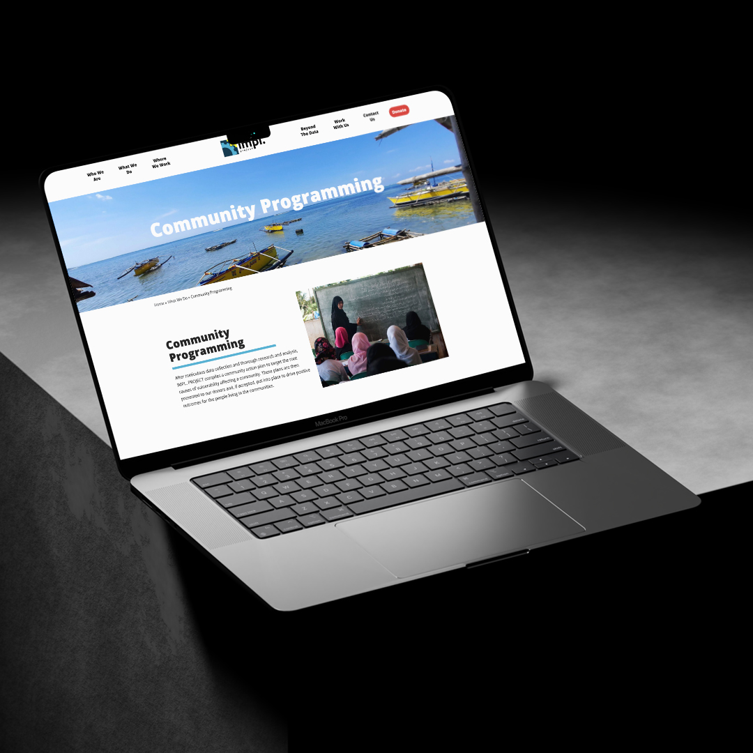 Community Programming web page displayed on laptop screen