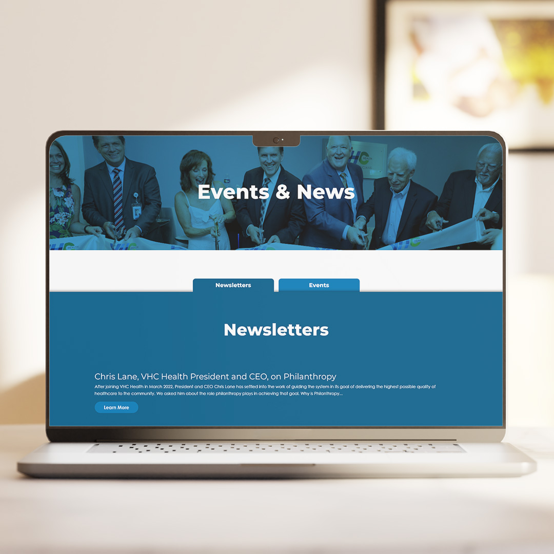Events & News web page displayed on a laptop screen